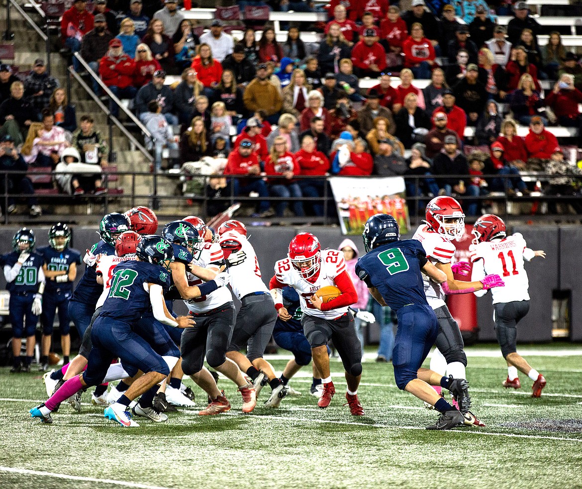 Warrior Jace Arca runs the ball during Friday's triumphant game against Valley Christian at Washington-Grizzly Stadium. (Jamie Reil photo)