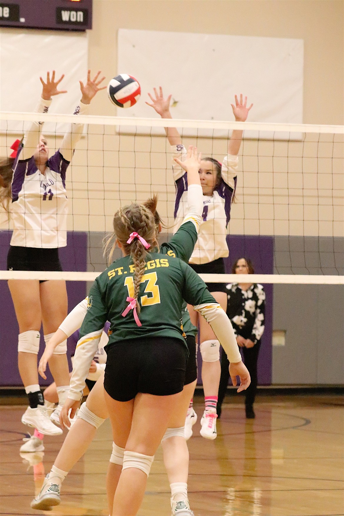 Lady Vikings Leah Cahoon and Aubrey Sharbono are poised to return the ball during last Thursday's match against St. Regis. (Michelle Sharbono photo)