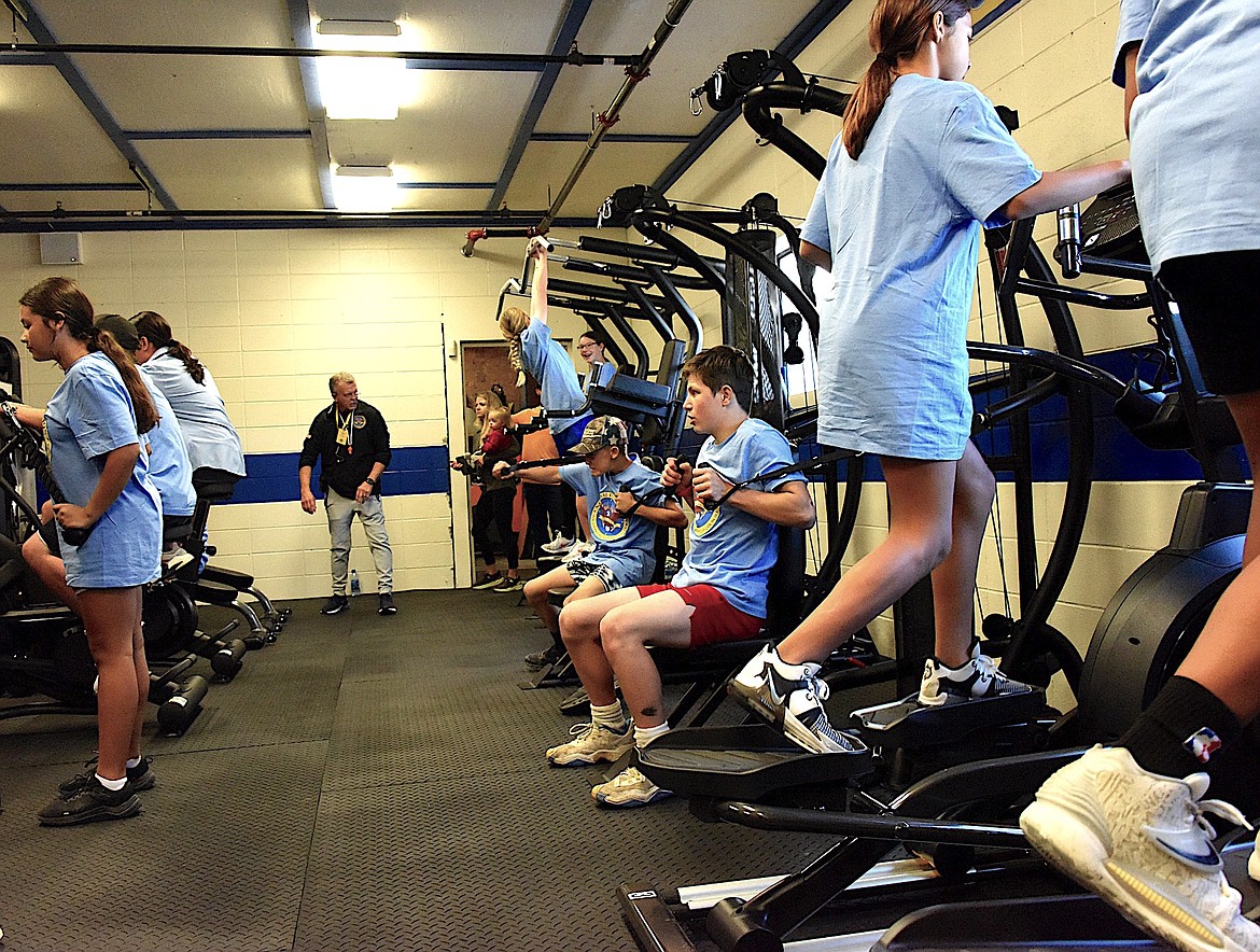 St. Ignatius middle school trainers work out in the brand new $100,000 fitness center awarded to the middle schoolers by National Foundation for Governors' Fitness Councils. (Berl Tiskus/Leader)