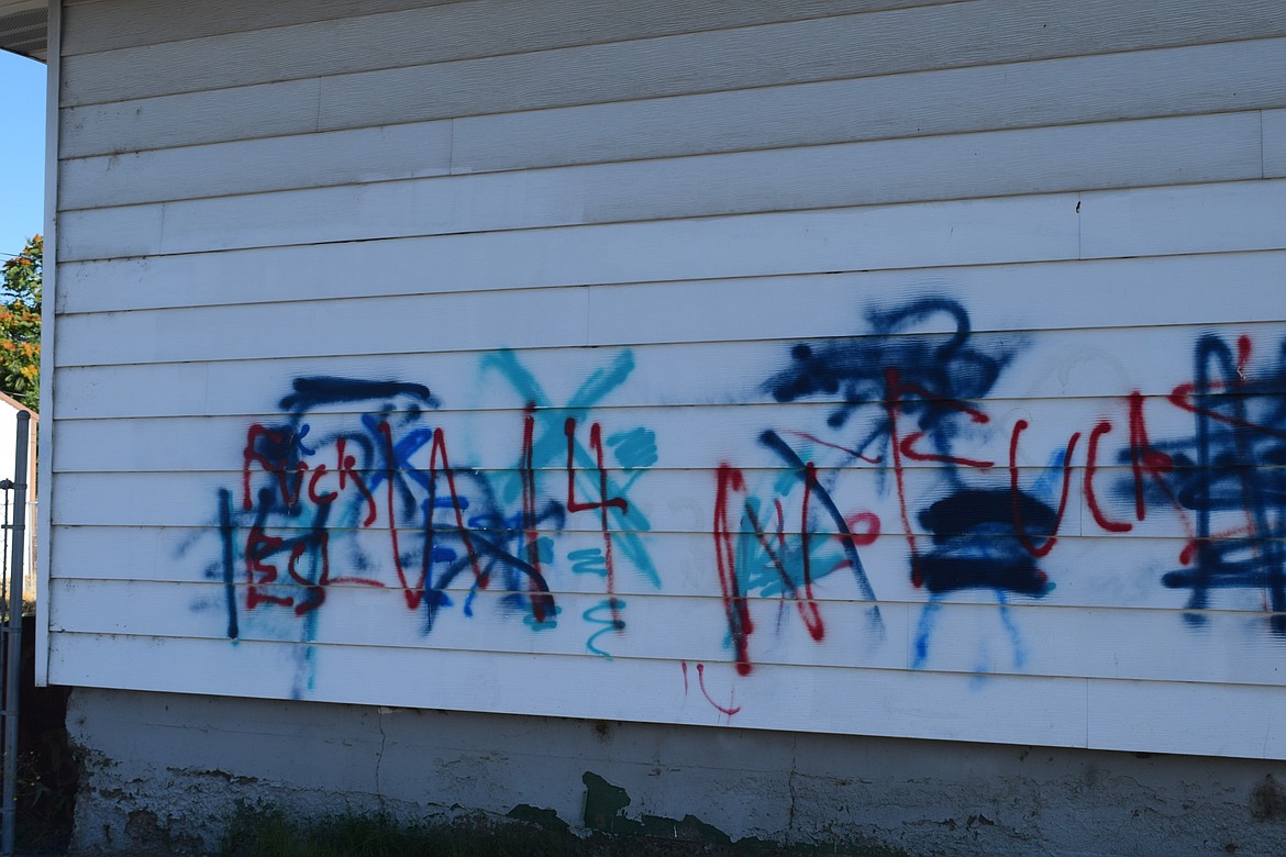 Multiple colors and a lack of spray paint on the grass indicate graffiti may have been on an Othello outbuilding for a while, said Othello Police Chief Dave Rehaume. The property owner may not have been aware it was there.