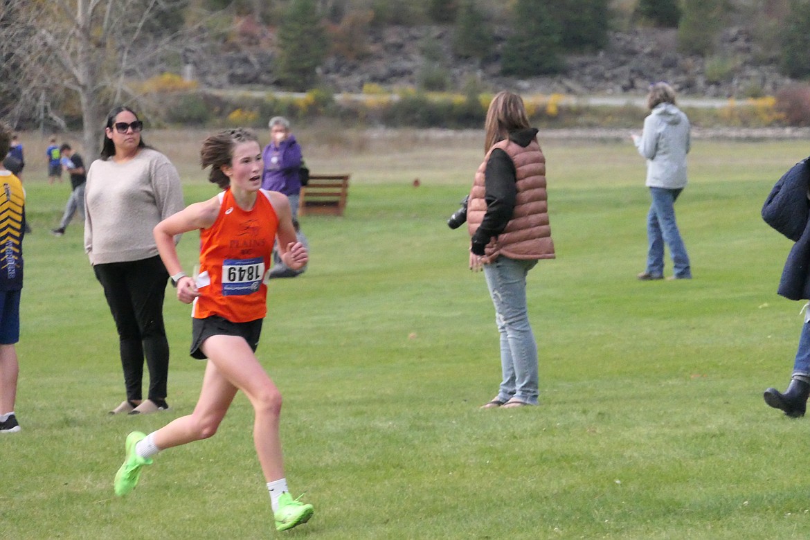 Plains freshman Marina Tulloch heads up the final hill on her way to first place in the individual standings at the Western Divisional B-C cross country finals last week in Thompson Falls. (Chuck Bandel/VP-MI)