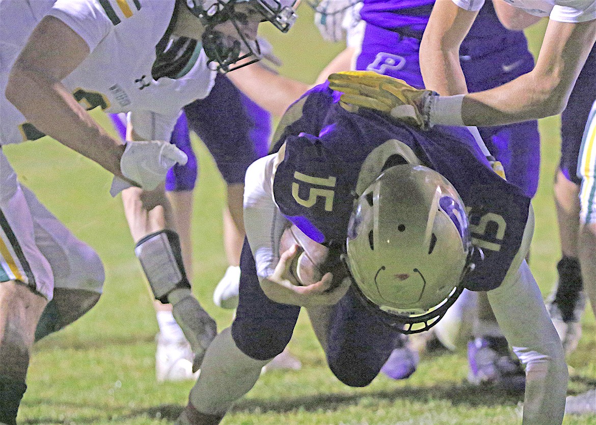 Pirate quarterback Holden Emerson goes low for a touchdown in last Friday's battle with the Whitefish Bulldogs. (Bob Gunderson photo)