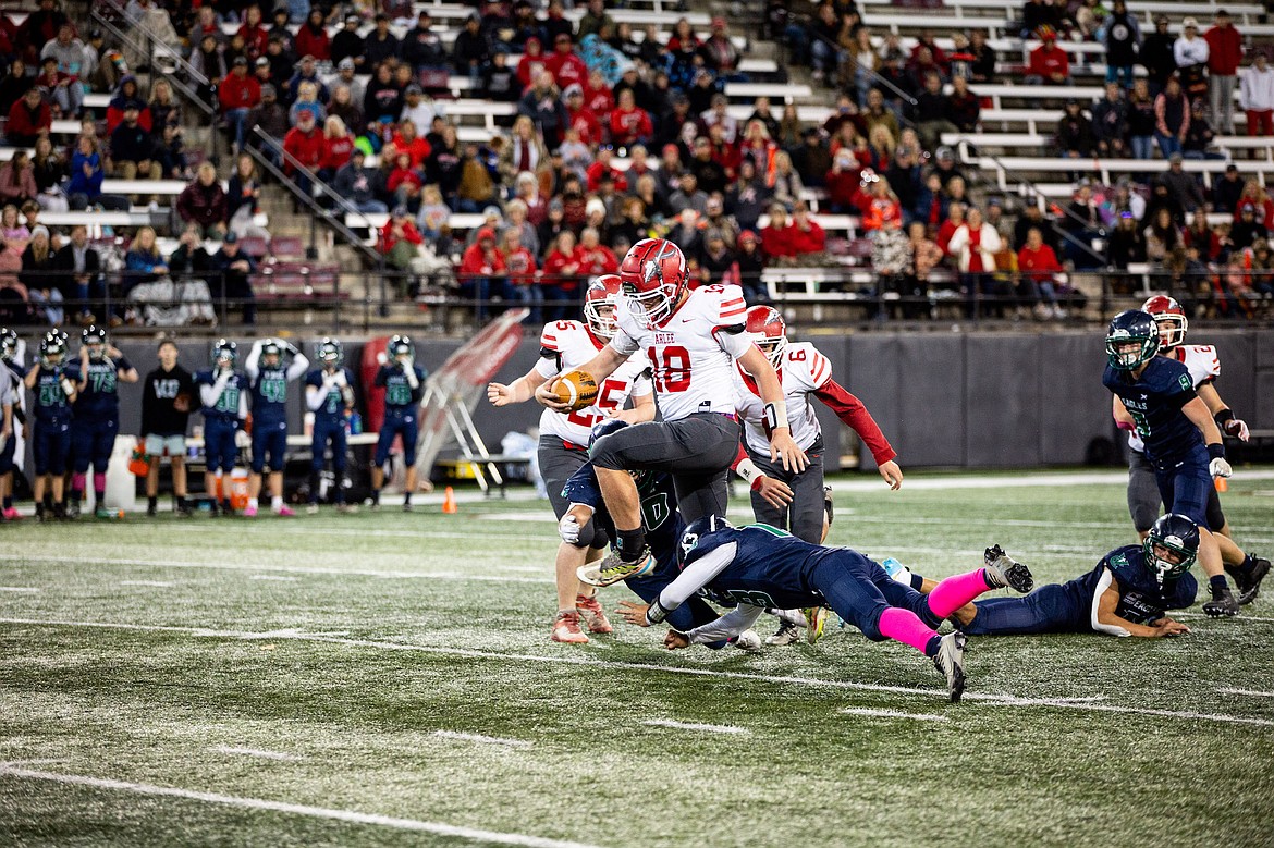 Warrior Tyrel Thomas tries to evade an Eagle blockade during Friday's game against Valley Christian. (Jamie Reil photo)