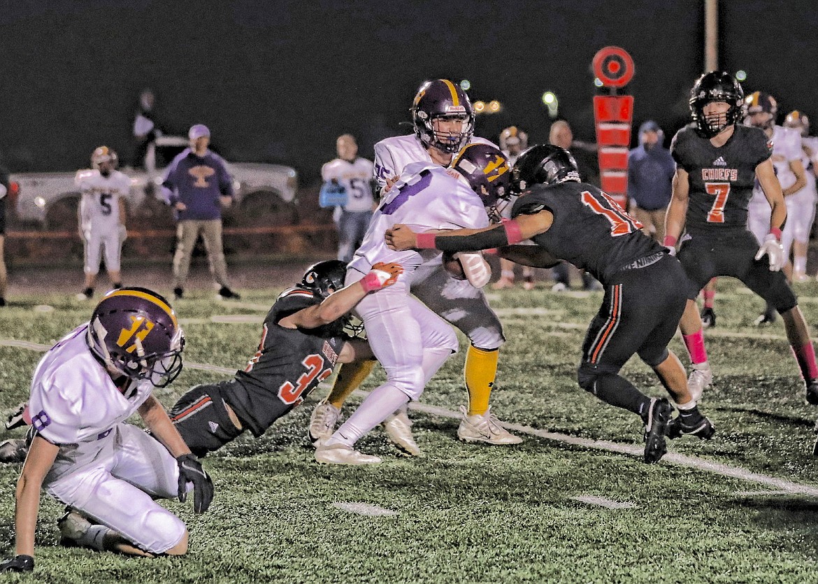 Chiefs WilJames Courville and Davonne Curley stop Livingston's momentum in last week's win against the Park High Rangers. (Susan Lake photo)