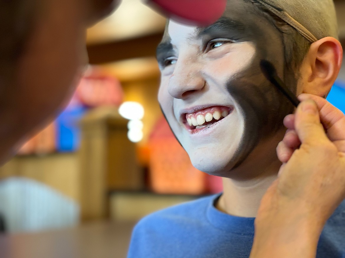 Director Betsi Morrison applies makeup to one of the student actors in an ATP Kids production of “Cats.” (Photo by Alpine Theatre Project)