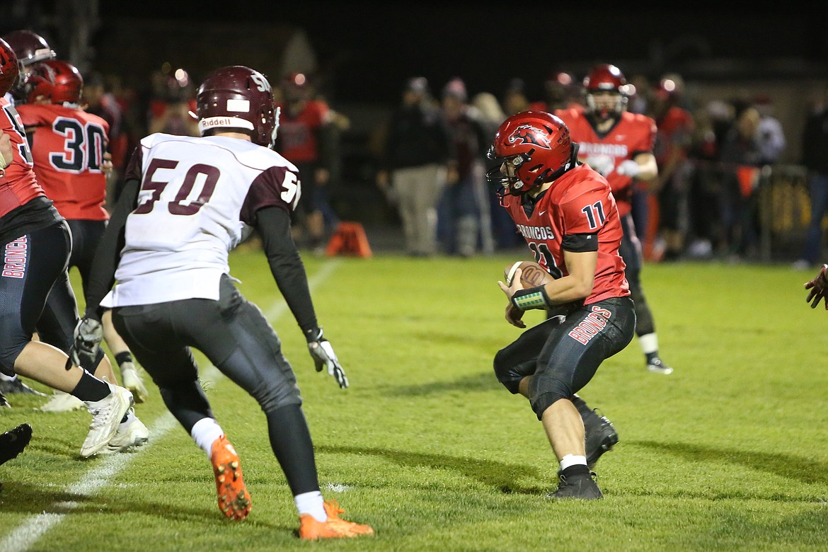 Lind-Ritzville/Sprague senior Travis Redburn (11) carries the football against Reardan on Friday. Redburn began the year as the team’s starting quarterback, but has moved to running back in light of the team’s recent injuries to the position.