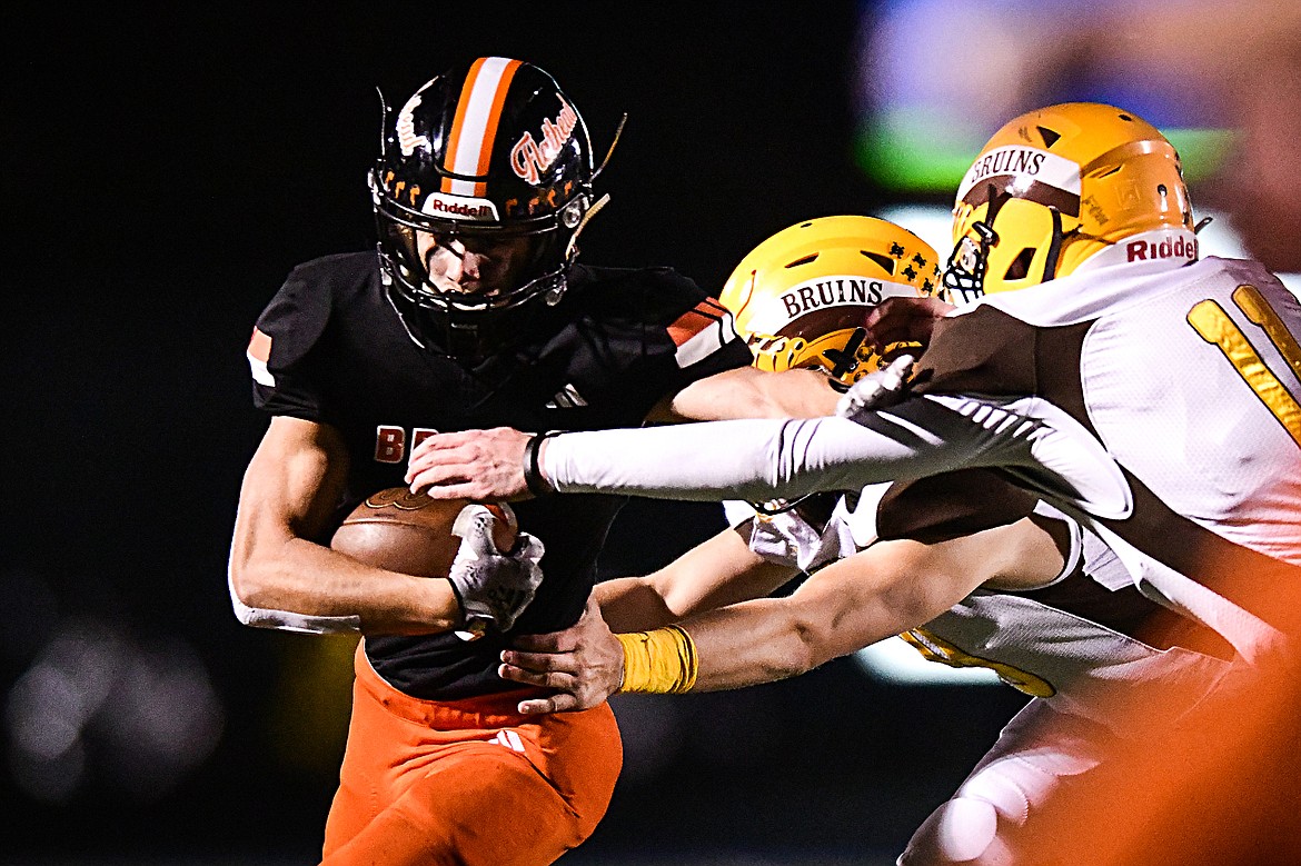 Flathead wide receiver Ben Bliven (2) picks up yardage after a reception in the third quarter against Helena Capital at Legends Stadium on Friday, Oct. 13. (Casey Kreider/Daily Inter Lake)