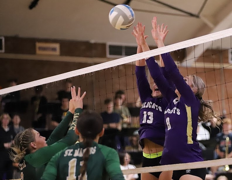 SIMON MILLER/Wildcats Live
Kellogg's Dani Hendrickson (13) and Emily Coe (1) block a St. Maries hit during the 2A District 1-2 championship match at Andrews Gymnasium on Wednesday. Defending for St. Maries are Naomi Mueller (2) and Lily Daniel (11).