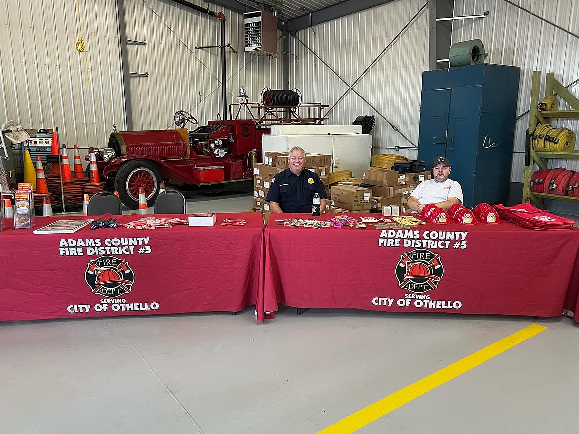 Members of Adams County Fire District 5 man the informational booth for the department at the ACFD 5’s Fire Prevention Week open house Oct. 12 at the station in Othello.