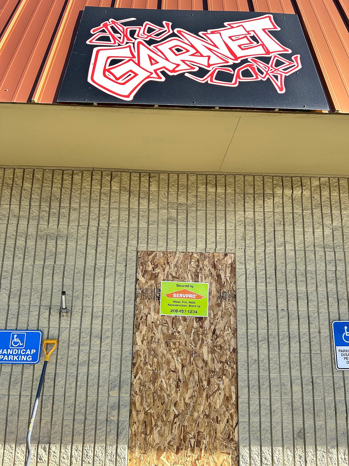 The door of the Garnet Cafe remains boarded up on Wednesday. The restaurant has been closed since it was damaged in an electrical fire on Sept. 14.