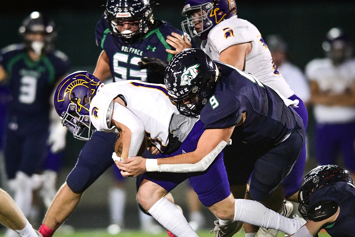 Glacier defensive lineman Isaac Keim (9) tackles Missoula Sentinel running back Brady Whitman (17) on a run in the third quarter at Legends Stadium on Thursday, Oct. 19. (Casey Kreider/Daily Inter Lake)