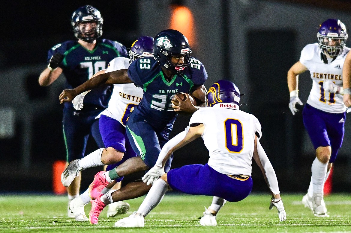 Glacier running back Kobe Dorcheus (33) picks up yardage on a run in the fourth quarter against Missoula Sentinel at Legends Stadium on Thursday, Oct. 19. (Casey Kreider/Daily Inter Lake)