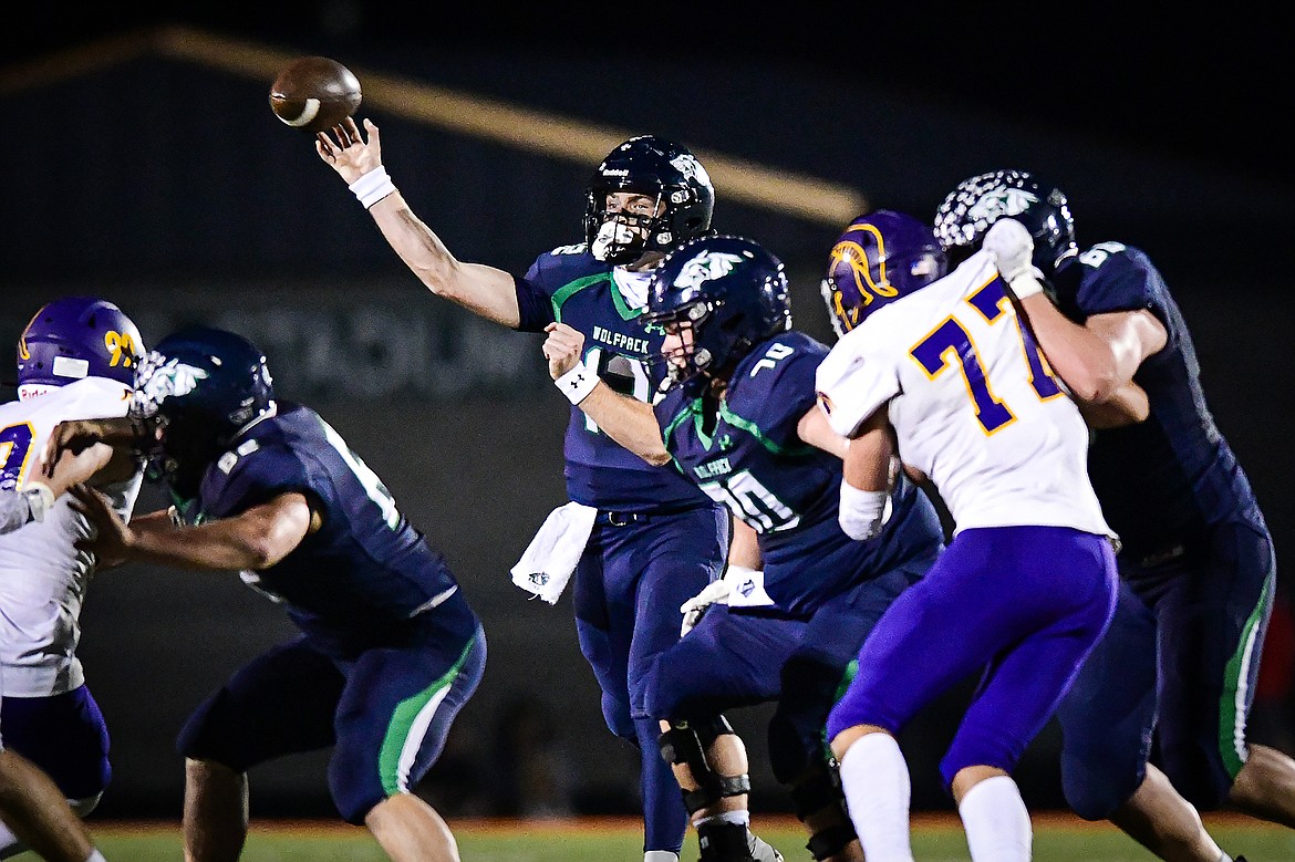 Glacier quarterback Jackson Presley (12) completes a 39-yard touchdown pass to wide receiver Bridger Smith in the third quarter against Missoula Sentinel at Legends Stadium on Thursday, Oct. 19. (Casey Kreider/Daily Inter Lake)