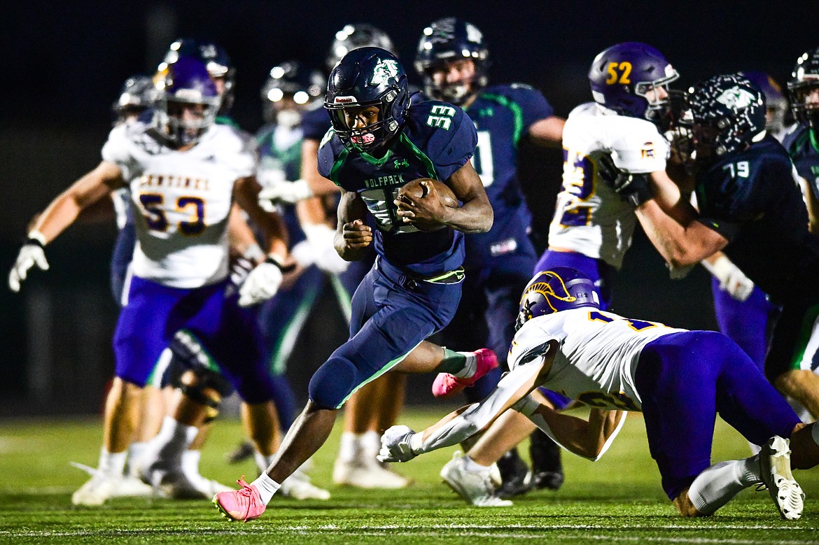 Glacier running back Kobe Dorcheus (33) picks up yardage on a run in the first quarter against Missoula Sentinel at Legends Stadium on Thursday, Oct. 19. (Casey Kreider/Daily Inter Lake)