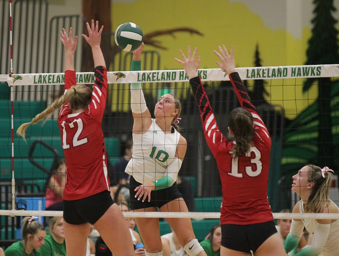 MARK NELKE/Press
Lakeland senior Lila Kiefer (10) hits between the block of Vivian Platte (13) and Livia Owens (13) of Sandpoint during the 4A Region 1 volleyball championship match Thursday night in Rathdrum.