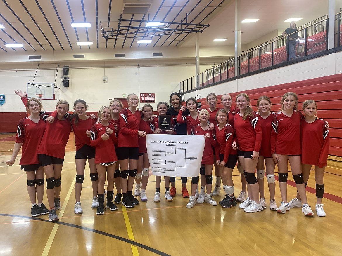 The Sandpoint Bullpup 7th grade volleyball 'B' team poses for a photo with the district championship bracket and their first-place plaque after defeating Lakeland in the championship match recently.