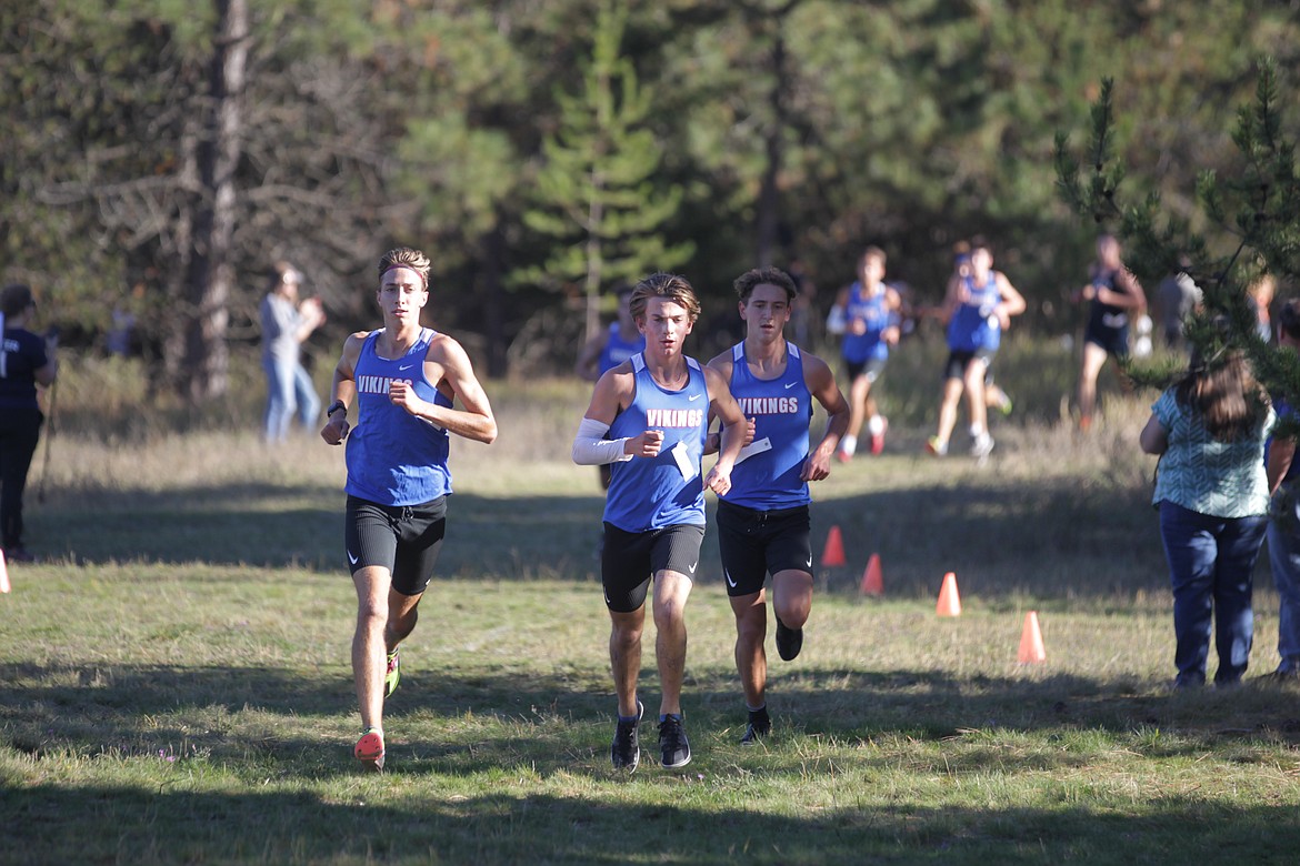 JASON ELLIOTT/Press
From left: Coeur d'Alene's Jacob King, Lachlan May and Max Cervi-Skinner finish the first loop of the 5A Region 1 cross country meet at Farragut State Park in Athol.