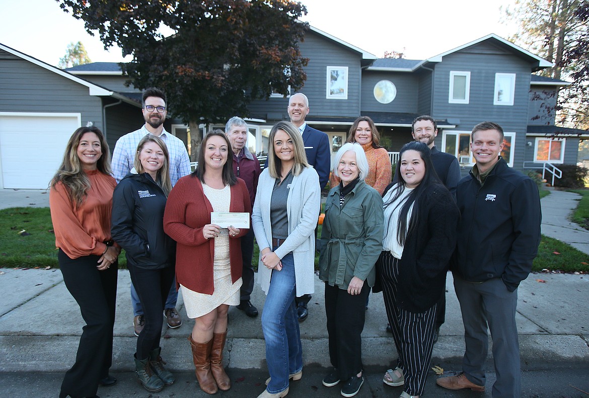 Silverwood Theme Park donated $100,000 to Children's Village during a presentation Thursday morning in Coeur d'Alene. Front row, from left: Rosa Mettler, Nicole Jacklin, Vanessa Moos, Stephanie Sampson, Nancy Porte, Emily Aizawa and Jordan Carter. Back row: Justin Schorzman, Dr. Tom Rau, Chris Liermann, Marie Nail and Michael Armon.