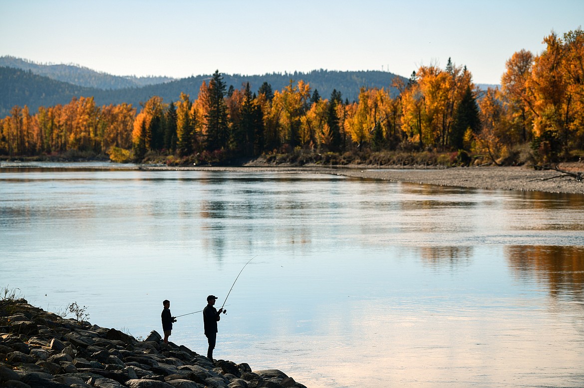 Logan and Cody Youell fish along the banks of the Flathead River on Wednesday, Oct. 18. (Casey Kreider/Daily Inter Lake)