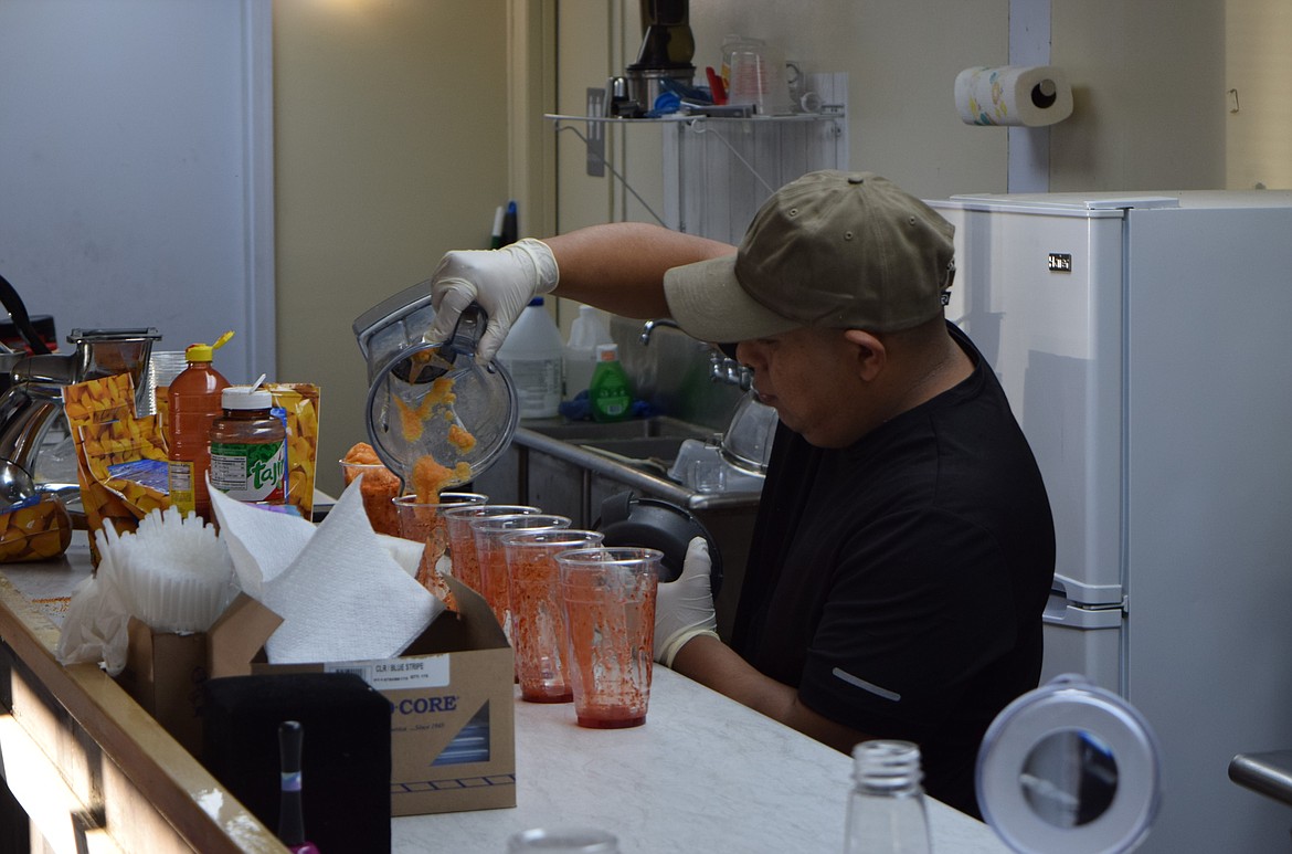 Salvador De Jesus Solano prepares drinks at Heavenly Fresh, a juice bar in Othello that Solano co-owns with his wife, Emily Cordero.