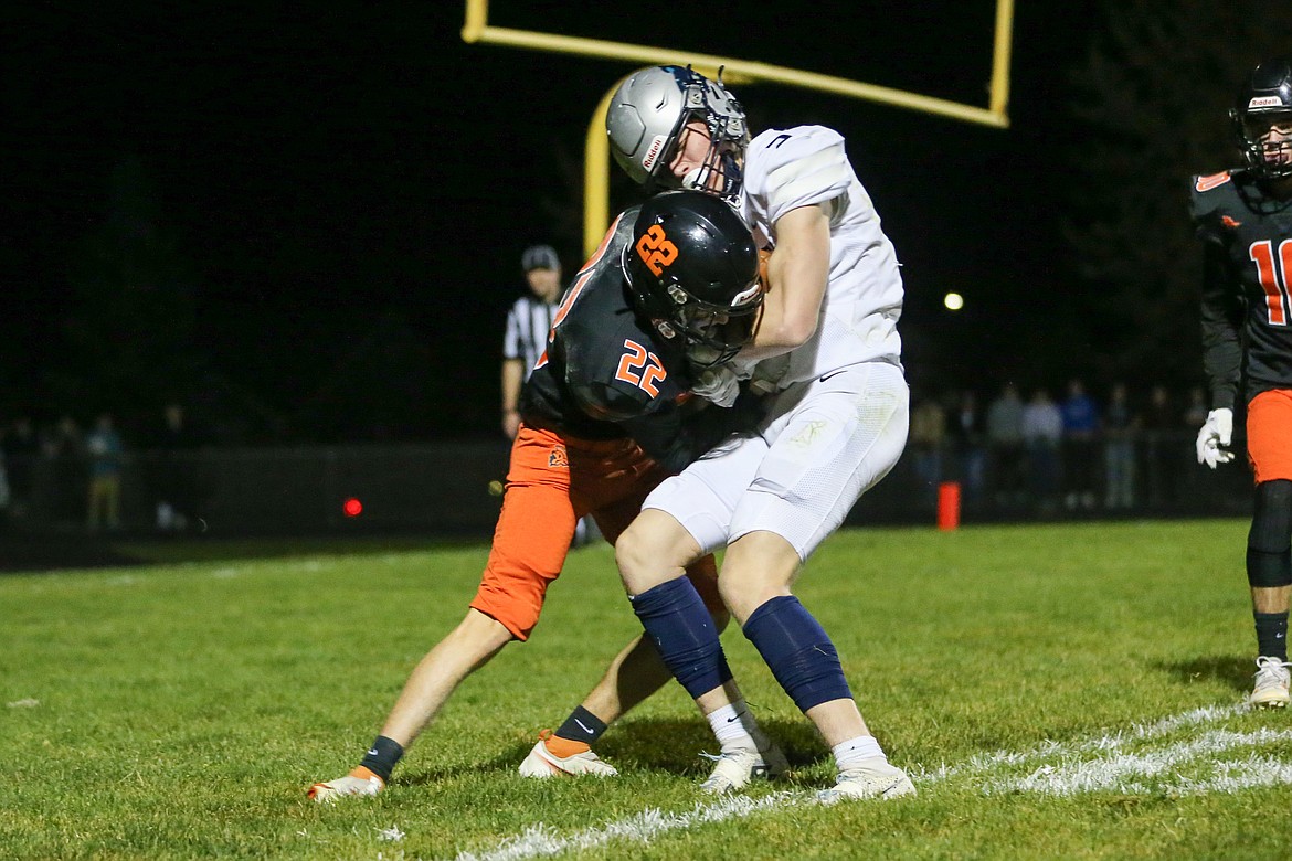 JASON DUCHOW PHOTOGRAPHY
Lake City junior wide receiver Travis Usdrowski is hit by Post Falls senior defensive back Blair Crane as he crosses the goaline in the second quarter of Thursday's game at Trojan Stadium.