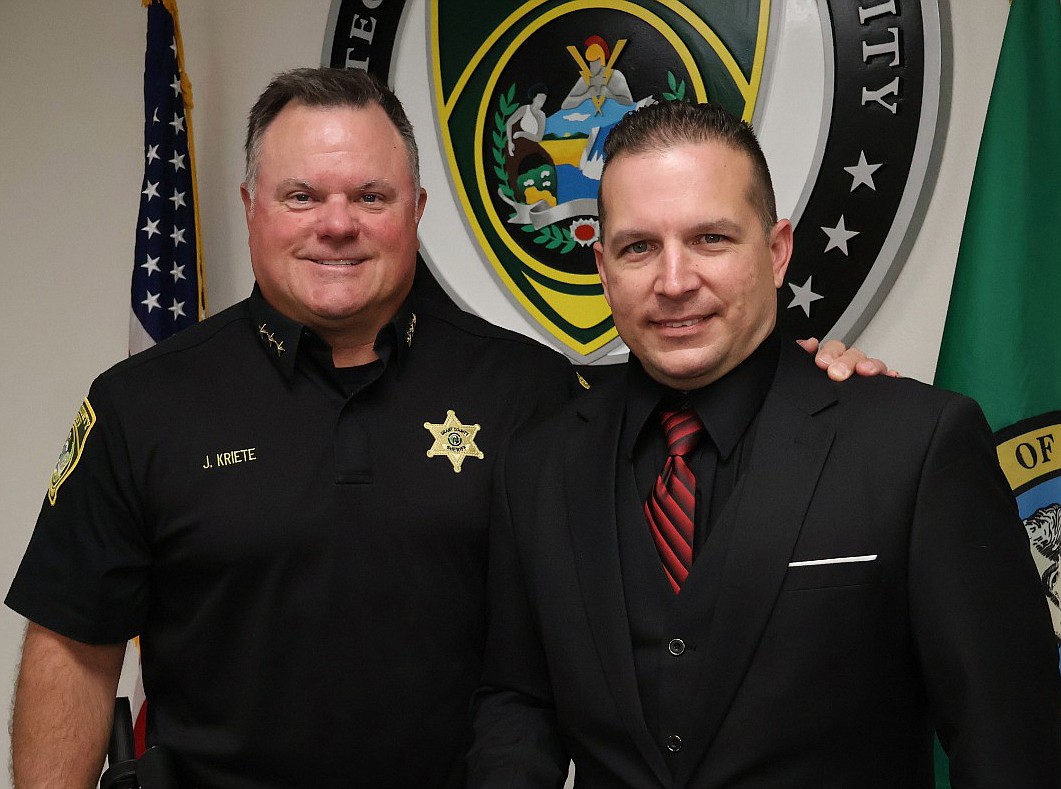 Corrections Deputy Philip Moisher, right, was sworn in on Monday by Grant County Sheriff Joe Kriete, left.