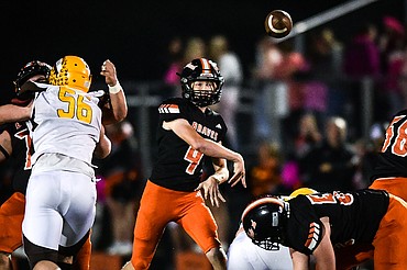 Flathead quarterback Brett Pesola (4) completes a pass to tight end Gabe Sims (84) in the first quarter against Helena Capital at Legends Stadium on Friday, Oct. 13. (Casey Kreider/Daily Inter Lake)