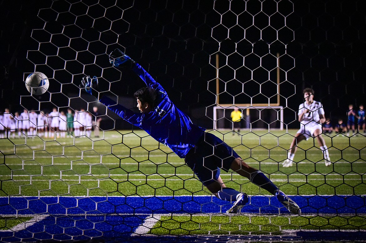 Glacier goalkeeper Silas Young (1) can't reach the game-winning penalty kick by Billing West's Aidan Benton (2) in an overtime round of penalty kicks at Legends Stadium on Friday, Oct. 20. (Casey Kreider/Daily Inter Lake)