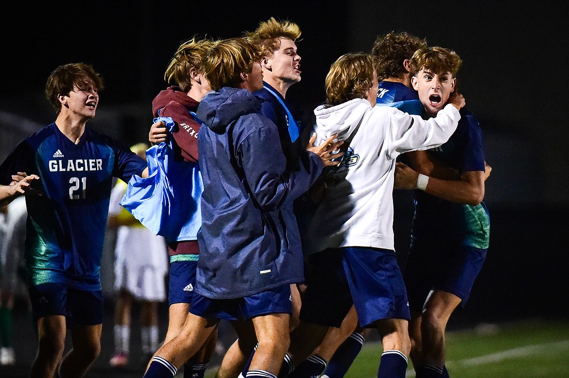Glacier celebrates with Hans Coggins (11, right) after his goal on a free kick in the second half against Billings West at Legends Stadium on Friday, Oct. 20. (Casey Kreider/Daily Inter Lake)