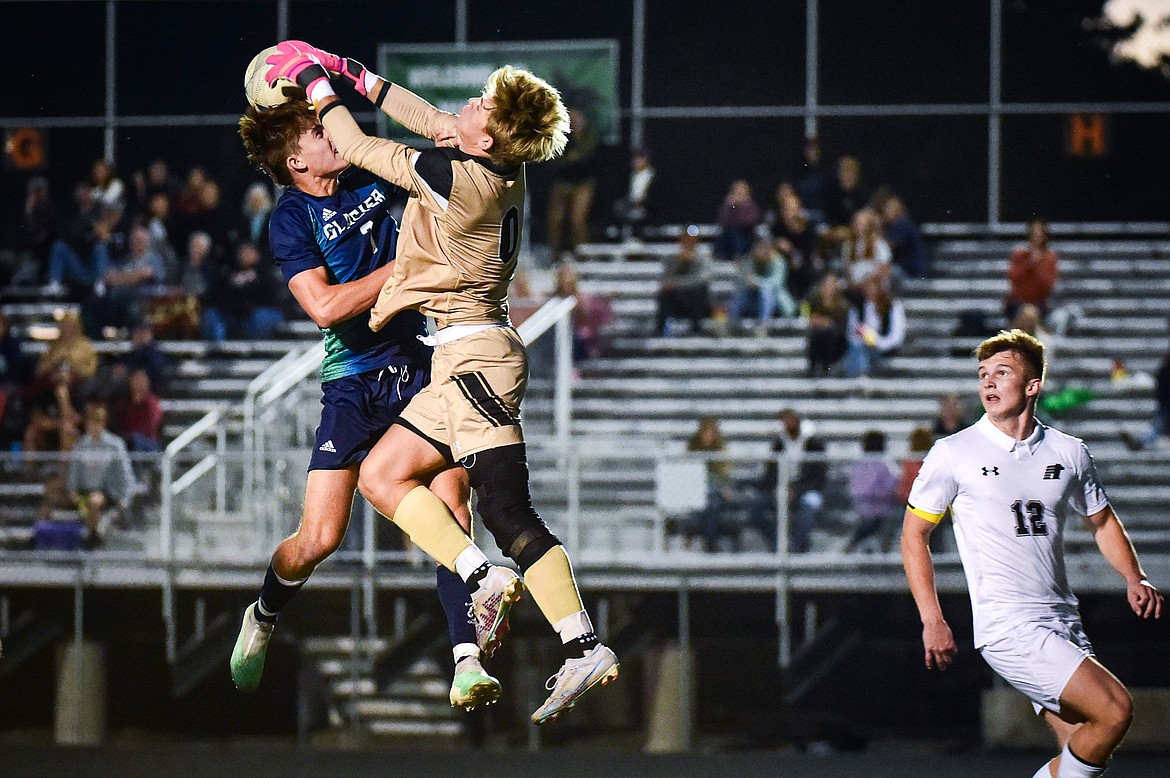 Glacier's Joey Paolini (7) and Billings West goalkeeper Brennen Ellis (0) battle for a ball off a high bounce in the second half at Legends Stadium on Friday, Oct. 20. (Casey Kreider/Daily Inter Lake)