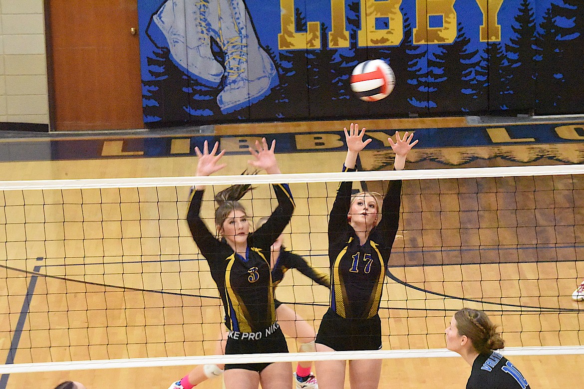 Libby's Lyndee McElmurry (17) and Molly Gotham (3) battle at the net against Bigfork during their match on Thursday, Oct. 19. (Scott Shindledecker/The Western News)