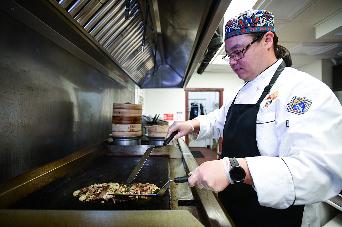 Chef Almaz Yussupov cooks the ingredients for his Turkish Gyro Roll at Hungry Hun Deli at the Kalispell Center Mall on Friday, Oct. 20. (Casey Kreider/Daily Inter Lake)