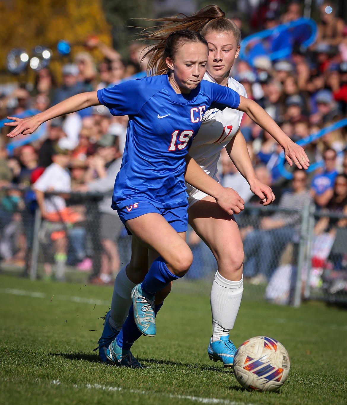 The Wildkats' Taylor Rodgers takes the ball from Bigfork's Ione Plummer in the second half of the State A soccer semifinal in Columbia Falls Saturday, October 21. (Jeremy Weber/Bigfork Eagle)