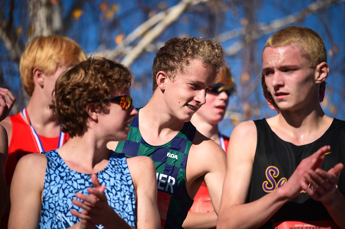 Glacier's Owen Thiel receives his medal for a 9th place finish in the Class AA boys race at the state cross country meet at Rebecca Farm on Saturday, Oct. 21. (Casey Kreider/Daily Inter Lake)