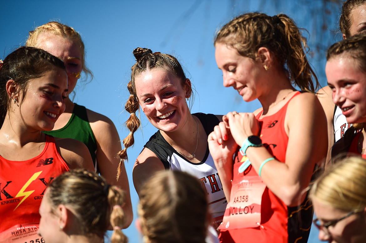 Flathead's Lilli Rumsey Eash receives her medal for a 12th place finish in the Class AA girls race at the state cross country meet at Rebecca Farm on Saturday, Oct. 21. (Casey Kreider/Daily Inter Lake)