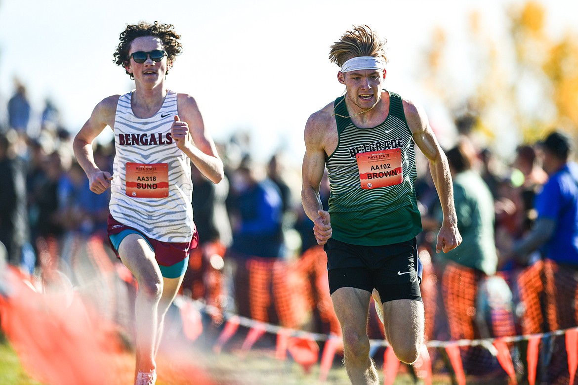 Helena's Henry Sund and Belgrade's Aidan Brown race to the finish in the Class AA boys race at the state cross country meet at Rebecca Farm on Saturday, Oct. 21. (Casey Kreider/Daily Inter Lake)