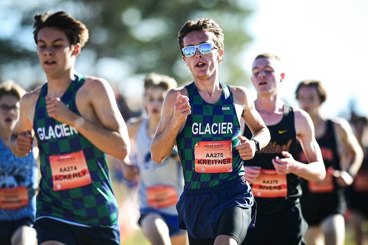 Glacier's Gabe Ackerly and Jonas Kreitner run the course in the Class AA boys race at the state cross country meet at Rebecca Farm on Saturday, Oct. 21. (Casey Kreider/Daily Inter Lake)