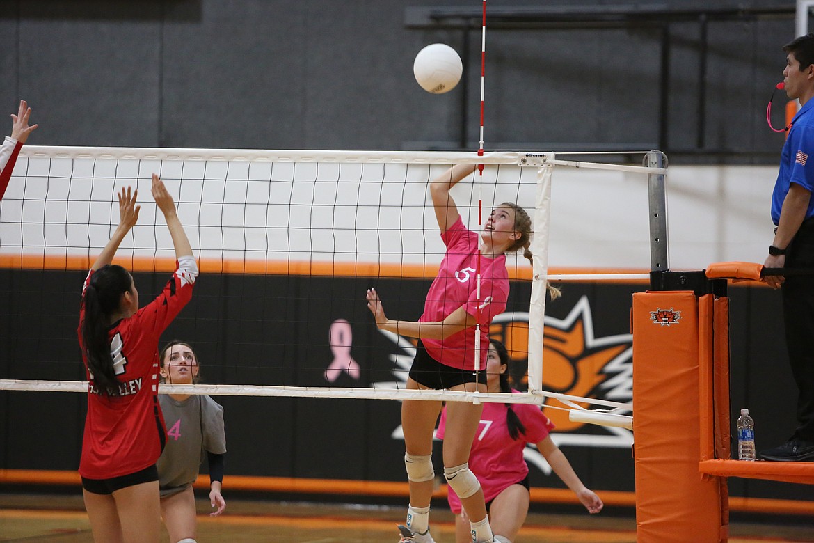 Ephrata junior Sienna Addink jumps up to spike the ball.