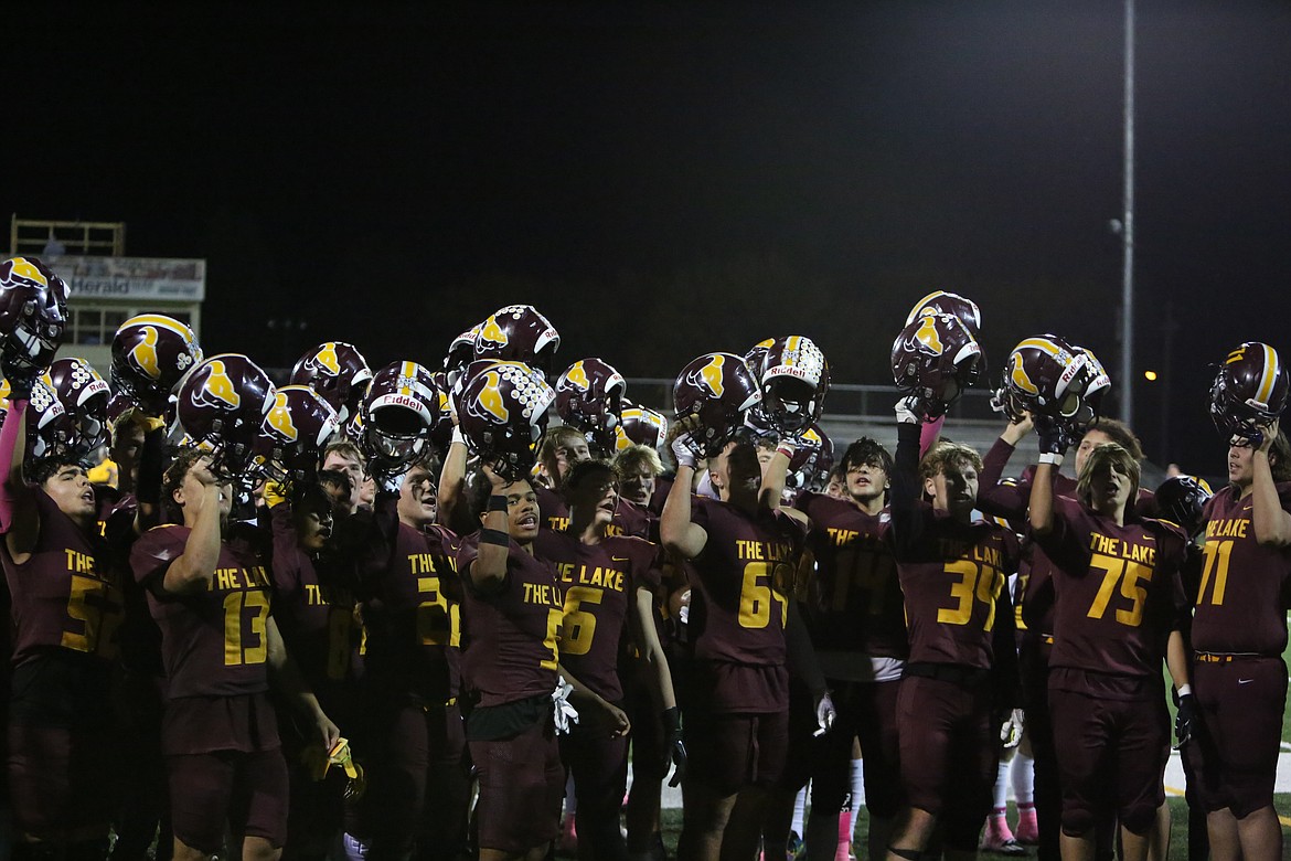 Moses Lake players celebrate next to the stands after the Mavericks’ win over West Valley (Yakima).