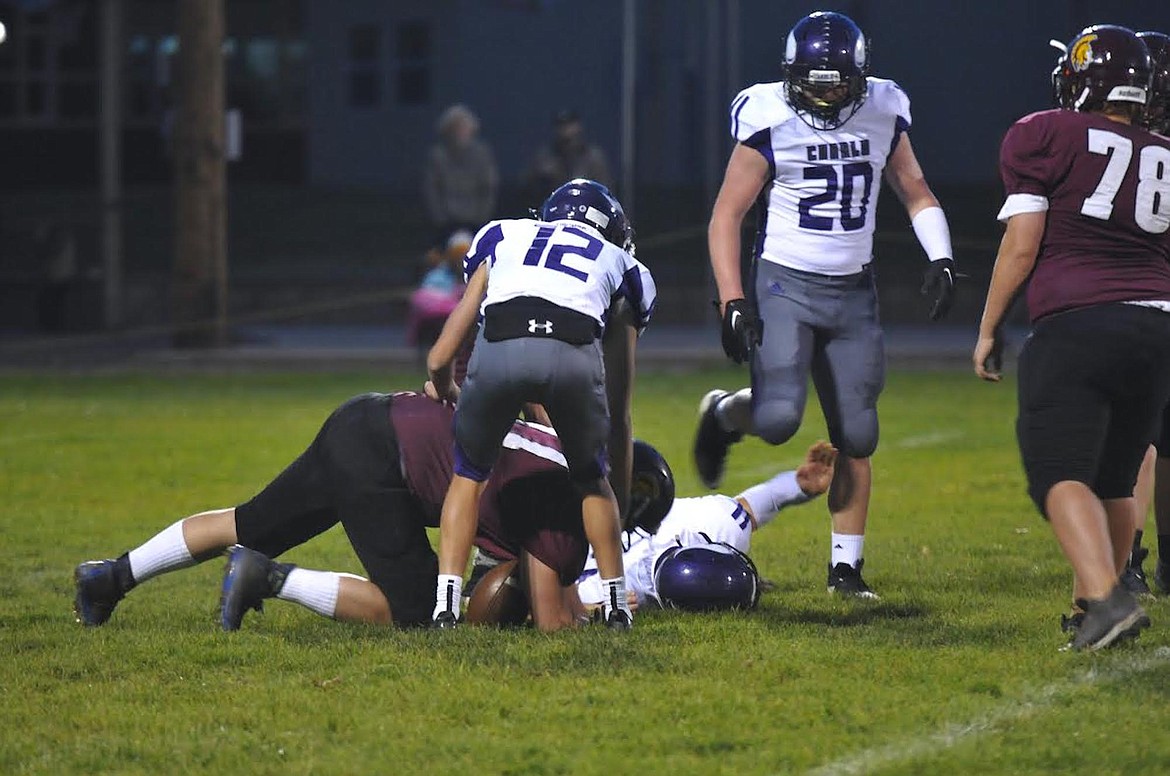 Troy defensive lineman Derek Cole makes a play against Charlo Friday, Oct. 20. (Hannah Chumley/The Western News)