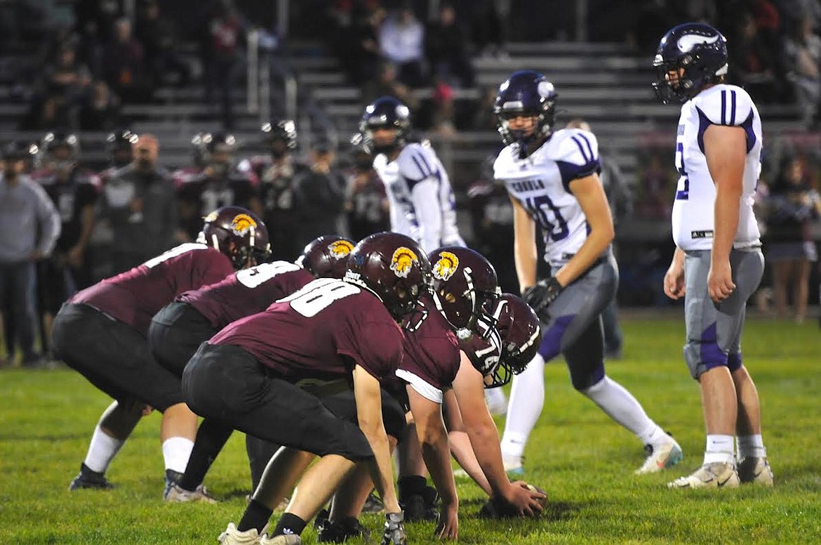 The Troy Trojans line up for a play against Charlo on Friday, Oct. 20. (Hannah Chumley/The Western News)