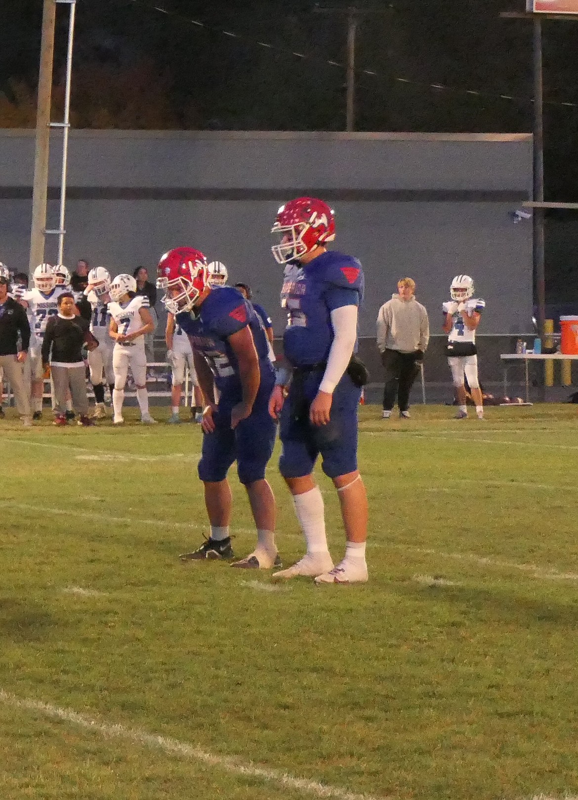 Superior running back Lucas Kovalsky (left) and quarterback Jaxson Green await a snap from center during the Bobcats 68-30 win over Mission Friday night in Superior.  (Chuck Bandel/MI-VP)