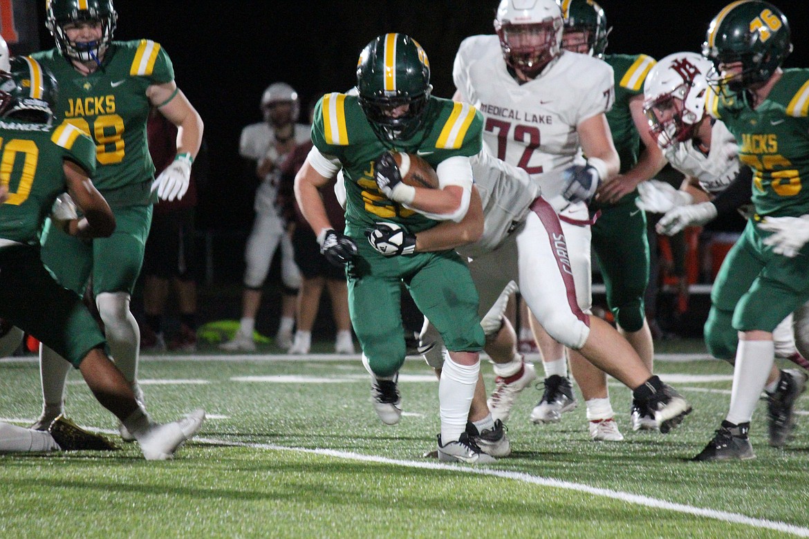 Jayden Richards (22) works to escape a Medical Lake defender