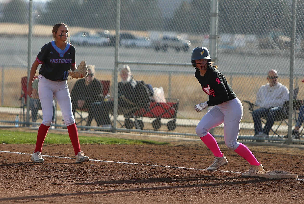 Moses Lake senior Mikayla Schwartz, right, leads off of first base in the bottom of the first inning against Eastmont on Saturday.