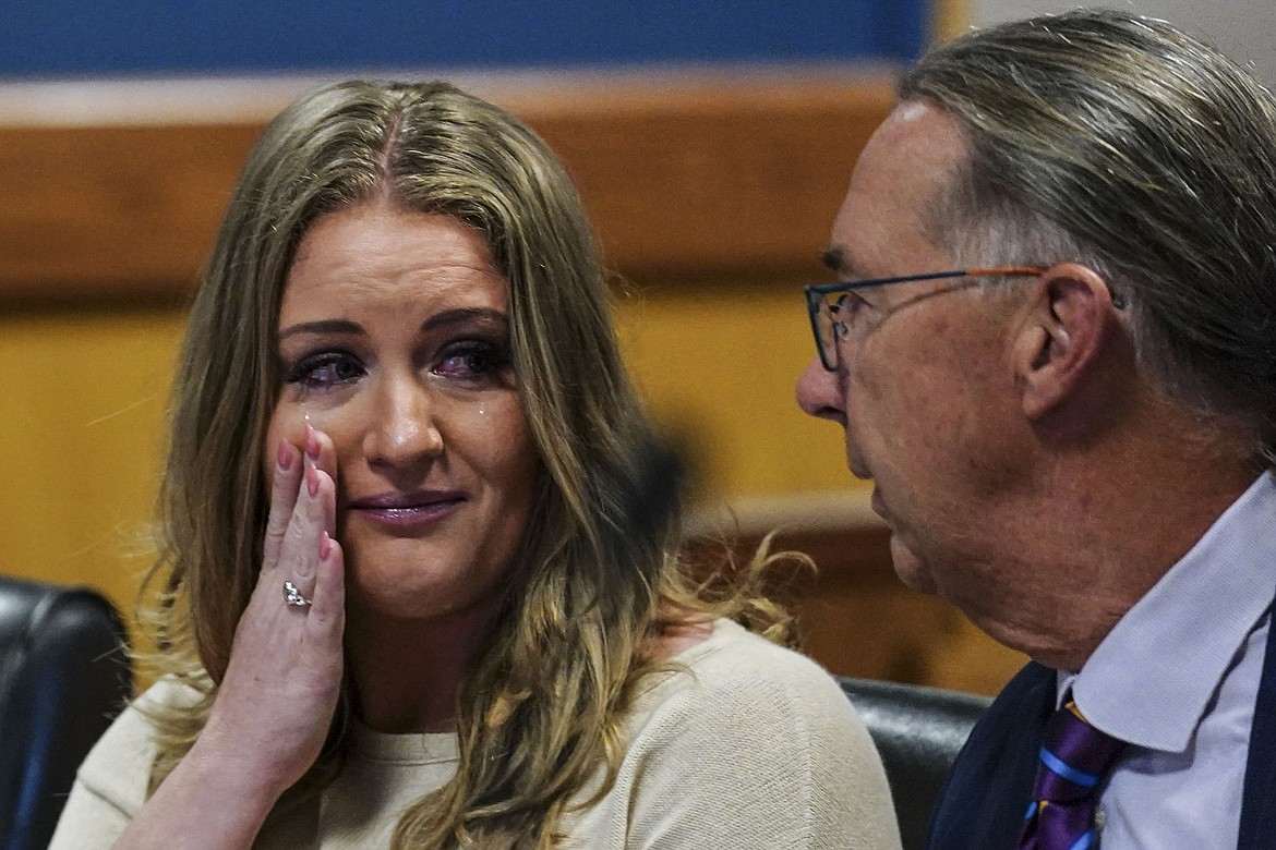 Jenna Ellis speaks with her attorney Franklin Hogue after Ellis plead guilty to a felony count of aiding and abetting false statements and writings, inside Fulton Superior Court Judge Scott McAfee's Fulton County Courtroom, Tuesday, Oct. 24, 2023, in Atlanta. Ellis, an attorney and prominent conservative media figure, reached a deal with prosecutors Tuesday, Oct. 24, 2023, and pleaded guilty to a reduced charge over efforts to overturn Donald Trump's 2020 election loss in Georgia.(AP Photo/John Bazemore, Pool)