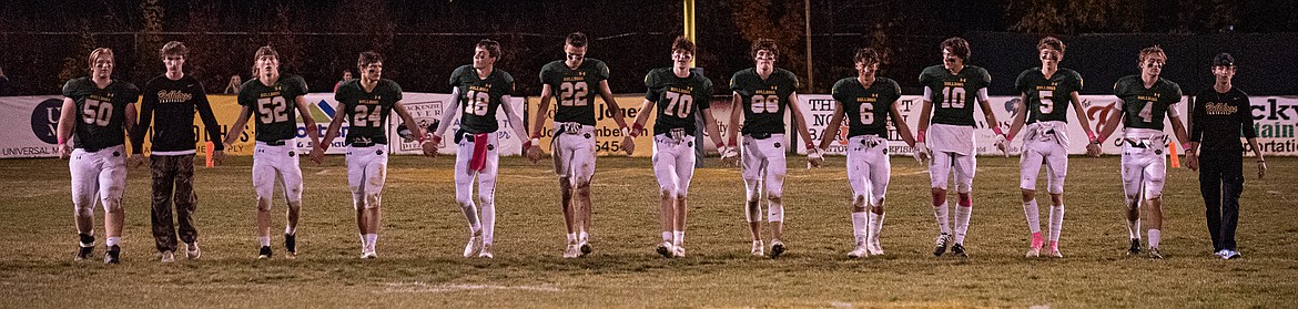 The Whitefish Bulldog seniors walk the field after their home game against Browning on Friday, Oct. 20. (Avery Howe/Hungry Horse News)