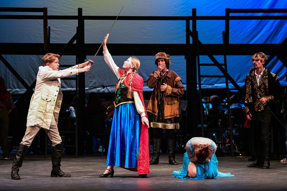 Flathead High School students rehearse a scene from the musical "Frozen" inside the auditorium on Tuesday, Oct. 24. Performing are, from left, Collin Olson  as Hans; Gracyne Johnson as Anna; Benjamin Moore as Kristof; Sophia Bennett as Elsa; and Ryan Kitzmiller as Weselton. (Casey Kreider/Daily Inter Lake)