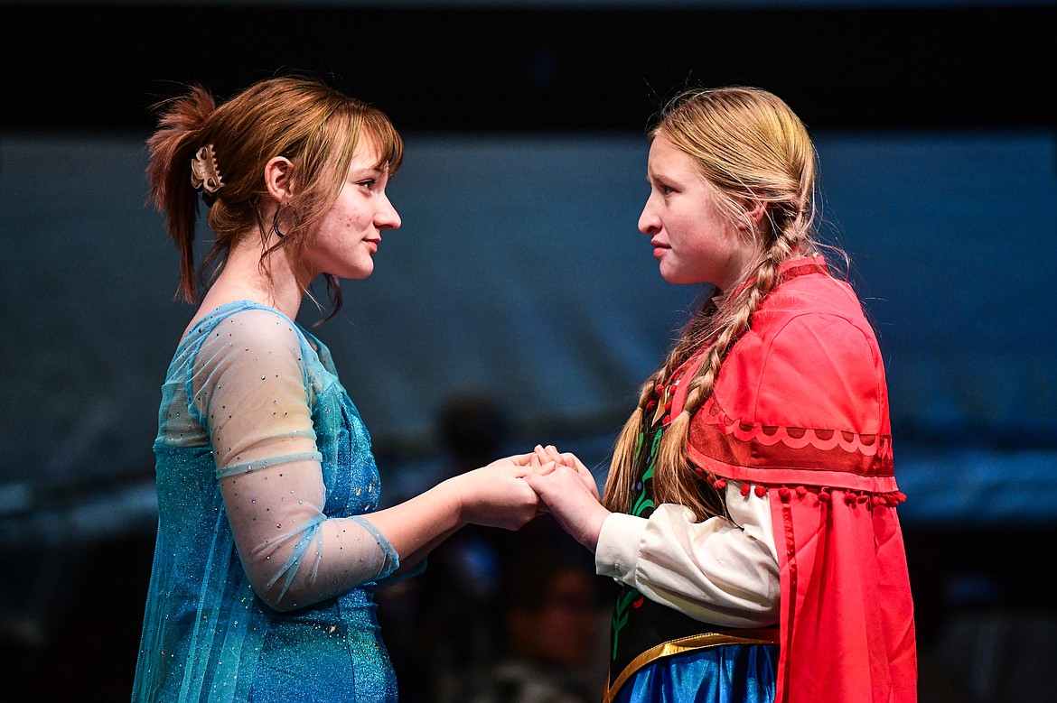 Flathead High School students Sophia Bennett, left, as Elsa, and Gracyne Johnson, right, as Anna, rehearse a scene from the musical "Frozen" inside the auditorium at Flathead High School on Tuesday, Oct. 24. (Casey Kreider/Daily Inter Lake)