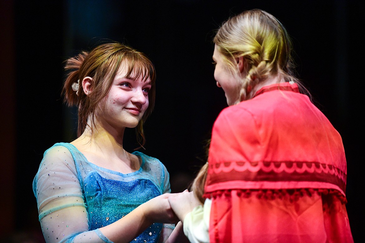 Flathead High School students Sophia Bennett, left, as Elsa, and Gracyne Johnson, right, as Anna, rehearse a scene from the musical "Frozen" inside the auditorium at Flathead High School on Tuesday, Oct. 24. (Casey Kreider/Daily Inter Lake)