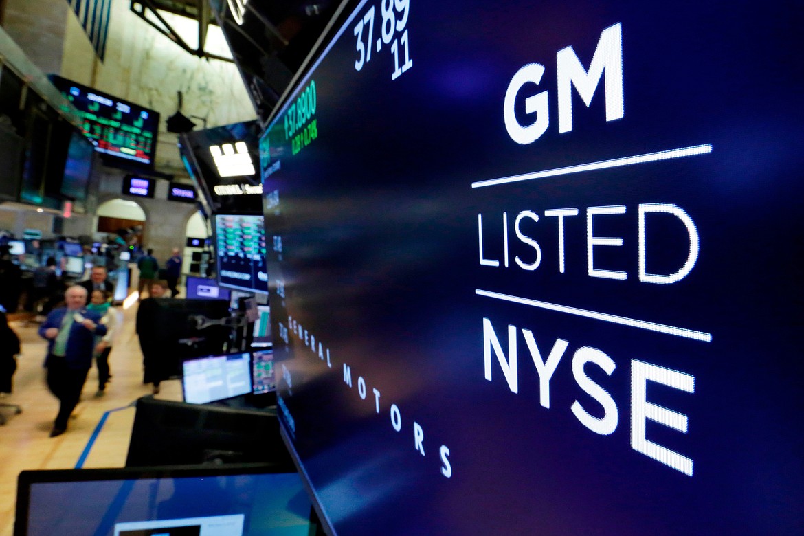 FILE- In this April 23, 2018, file photo, the logo for General Motors appears above a trading post on the floor of the New York Stock Exchange. General Motors reports earnings on Tuesday, Oct. 24, 2023. (AP Photo/Richard Drew, File)